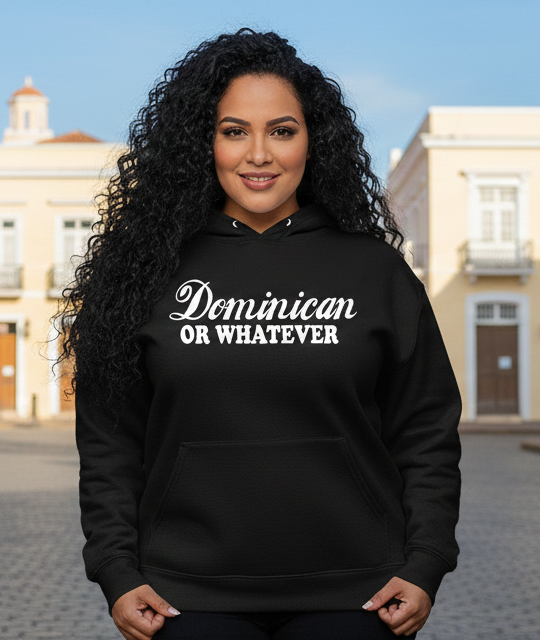 Woman wearing a black sweatshirt with 'Dominican or Whatever' text in an urban setting.