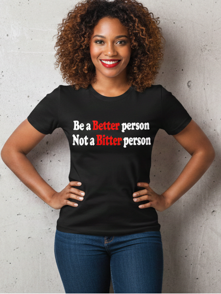 Woman wearing a black t-shirt with text on a gray background