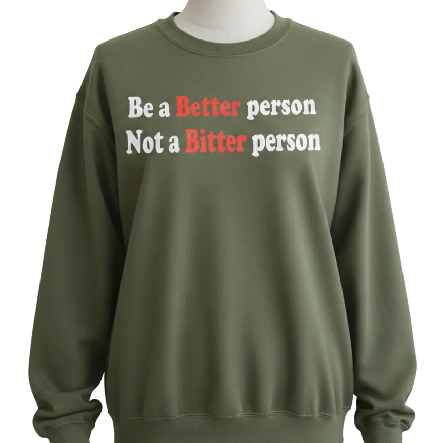 Green sweatshirt with motivational text on a gray background