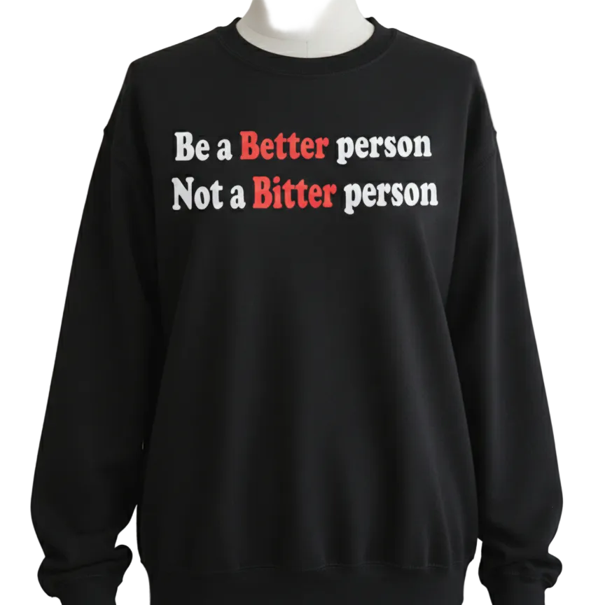 Black sweatshirt with motivational text on a gray background