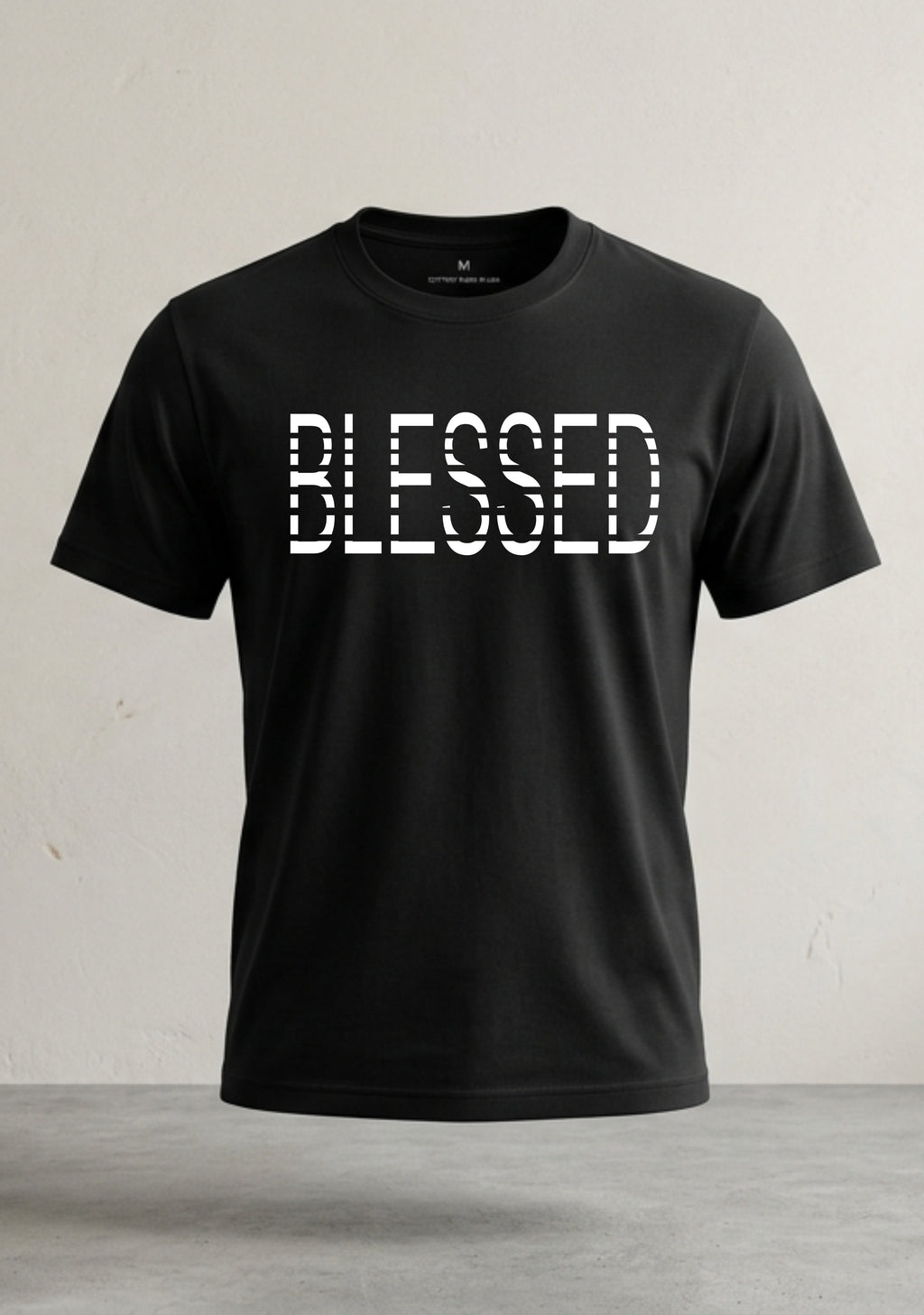Black t-shirt with 'BLESSED' text on a light gray background