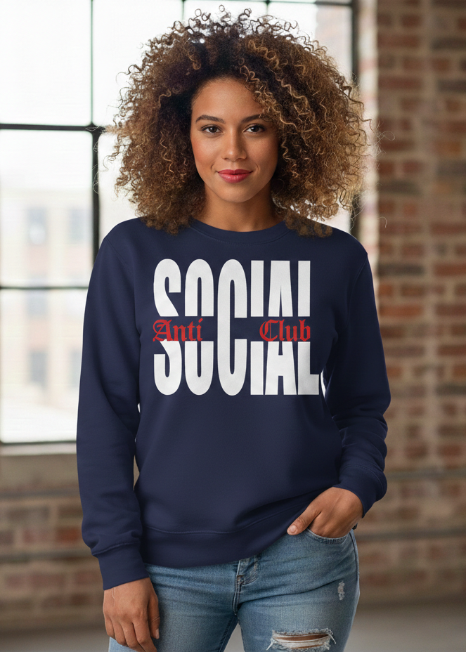 Woman wearing a navy blue sweatshirt with 'Social Club' text in front of a brick wall.