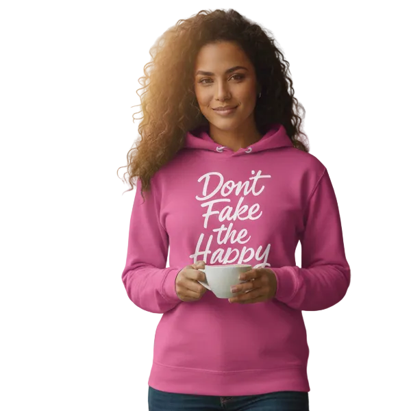Woman wearing a pink hoodie with text, standing in a cafe.