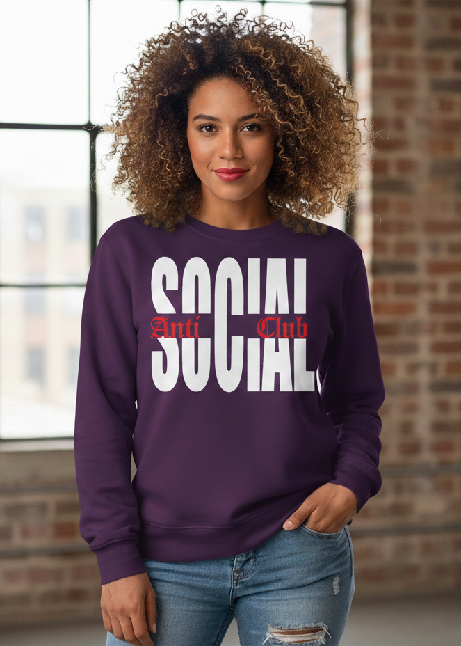 Woman wearing a purple sweatshirt with 'SOCIAL Club' text, standing in front of a brick wall.
