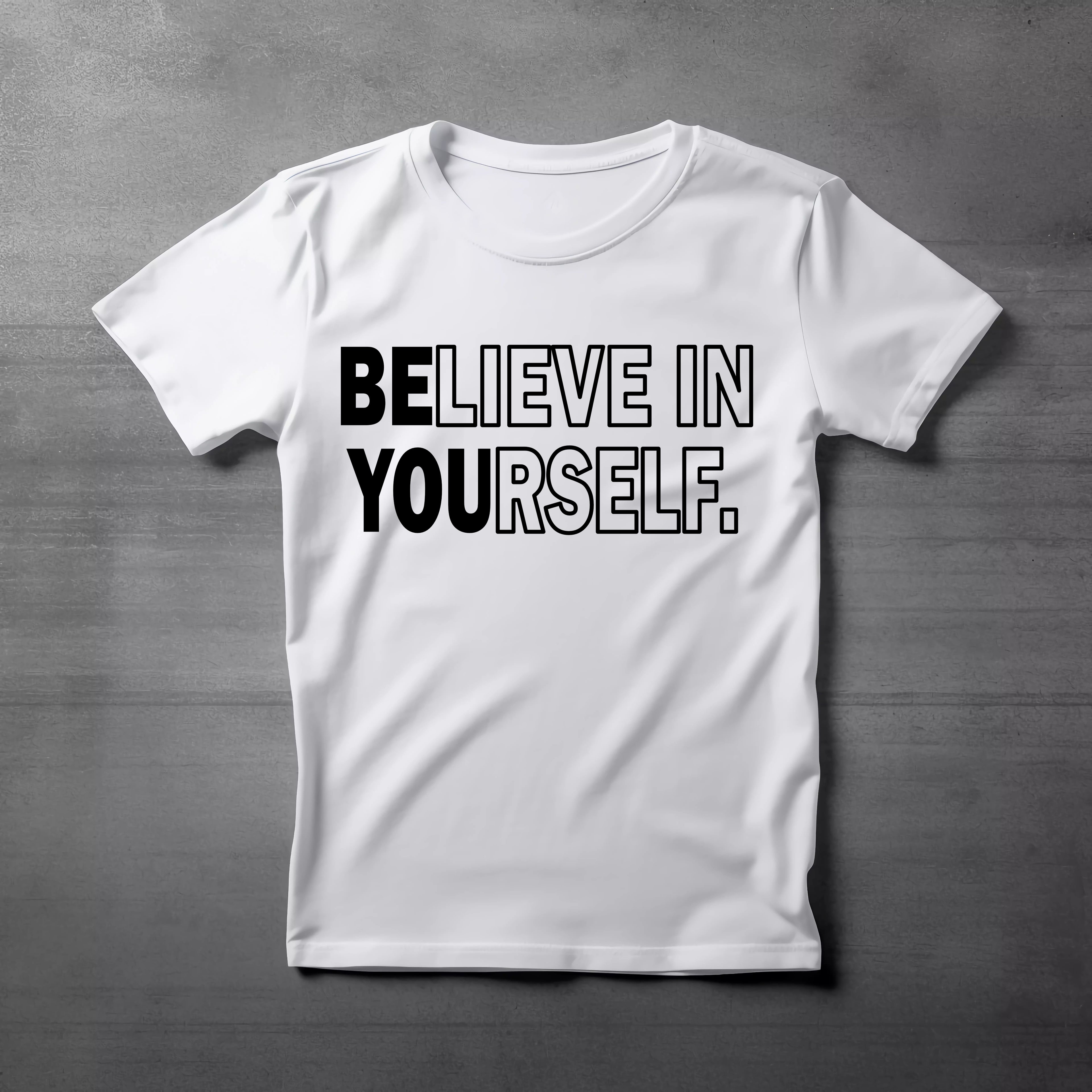 White t-shirt with 'BELIEVE IN YOURSELF' text on a gray background