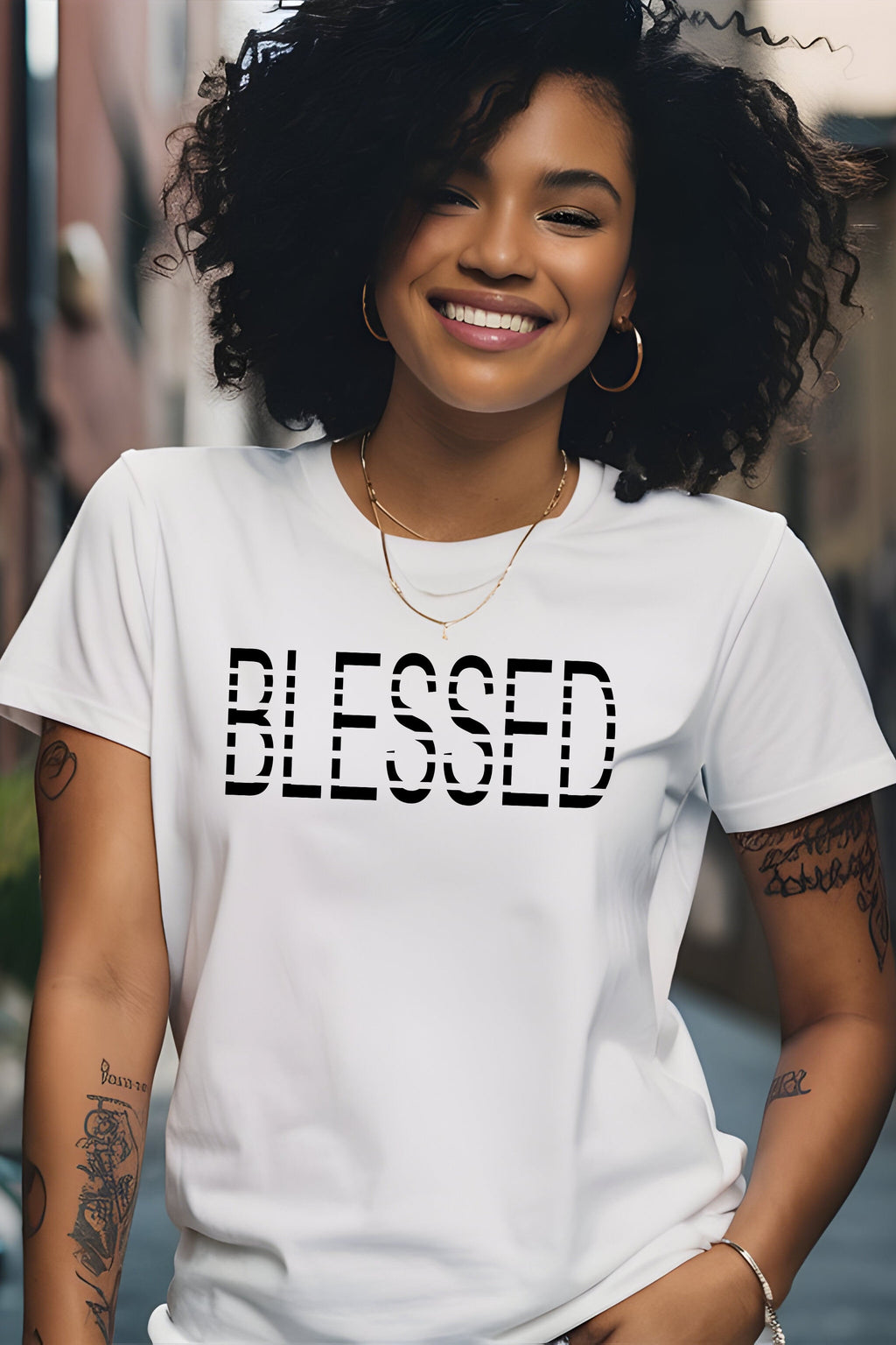 Woman wearing a white t-shirt with 'BLESSED' text in an urban setting